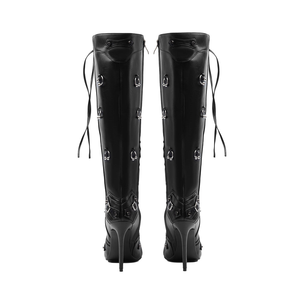 black stiletto knee-high boots showing slender high heels and zipper tassel accents.