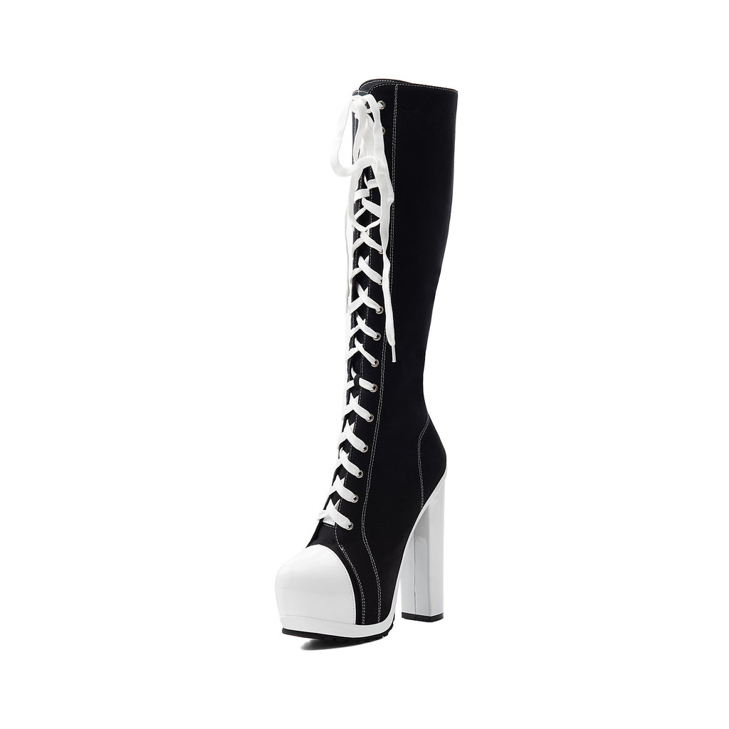 single black canvas lace-up knee-high boot featuring white toe cap and heel
