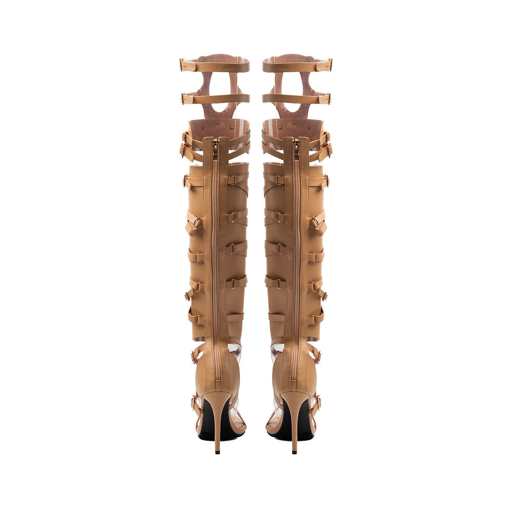 nude strappy gladiator boots showing full-length back zippers and stiletto heels.